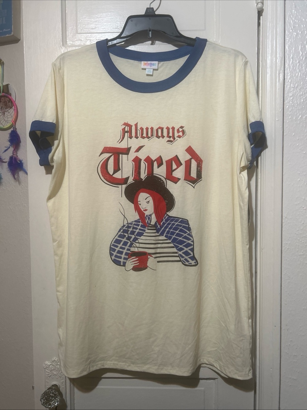 LuLaRoe Always Tired Cream Tee with Navy Ringer Detail